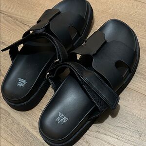 NWOT black sandals with adjustable Velcro strap 
Excellent condition NEW